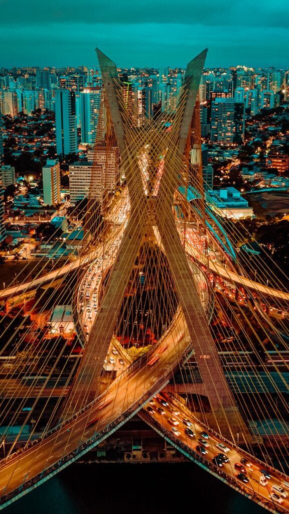 Stunning aerial view of São Paulo's Octavio Frias de Oliveira Bridge at night.